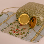 antique victorian locket holds two photographs