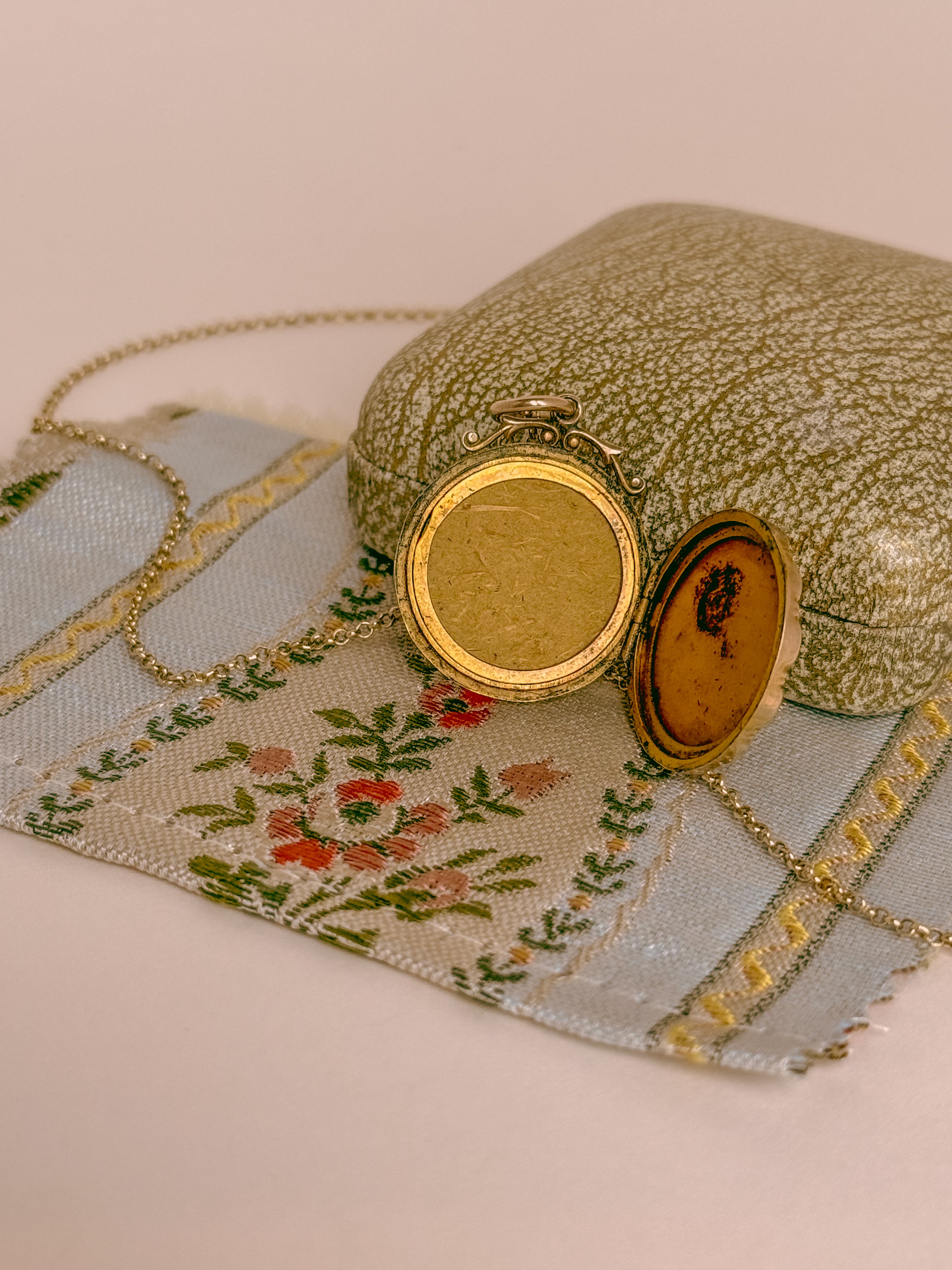 antique victorian locket holds two photographs
