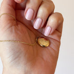 Hand engraved custom made solid gold locket