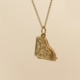 Secret piano jewellery charm in 9ct gold