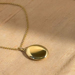 Oval locket necklace in 9ct and 14ct yellow gold