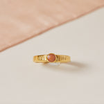 Coral rub over set stone ring