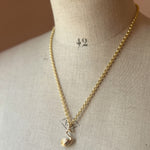 Gold necklace with a swan pendant