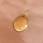 Solid gold locket with the words unforgettable engraved 