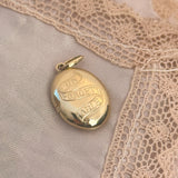 Antique inspired solid gold locket with the words unforgettable traditionally engraved 