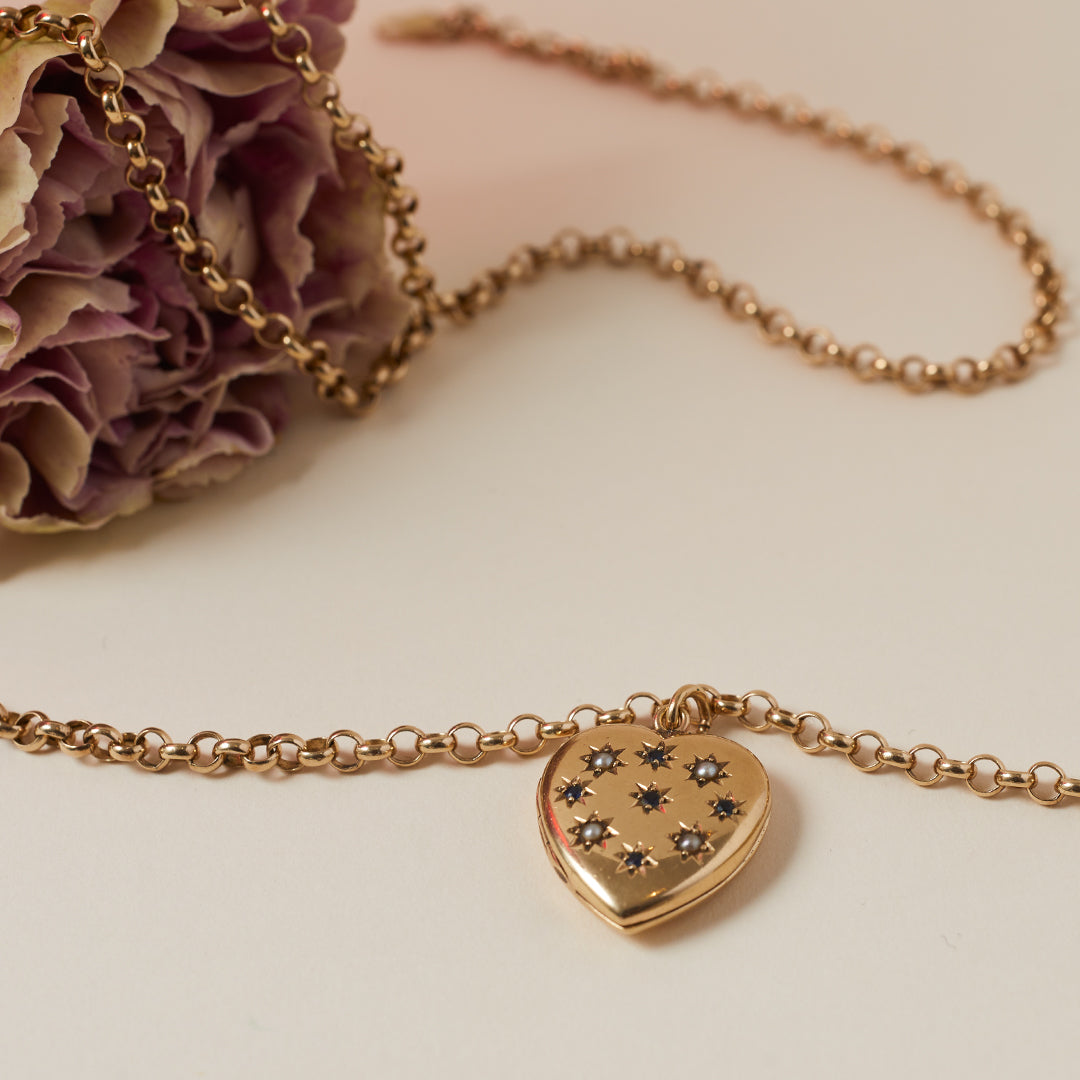 vintage heart locket with sapphire and seed pearls 