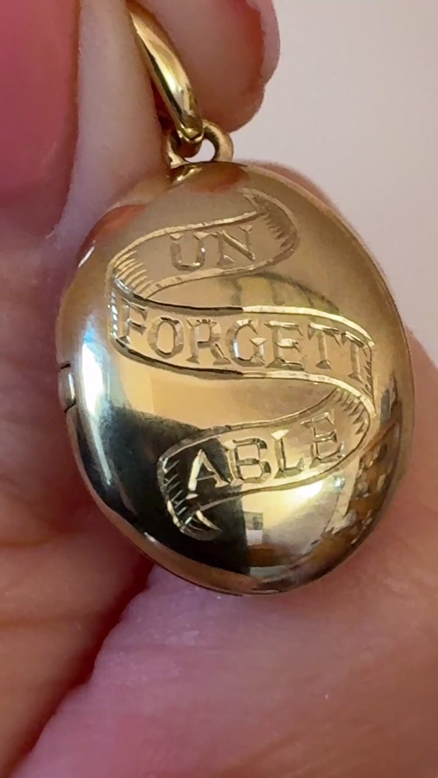 Solid gold locket showing the beautiful close up details of hand engraving 